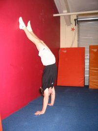 Handstand facing away from the wall, improper position